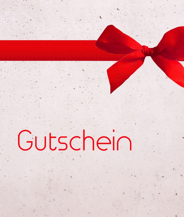 Das Bild zeigt einen Gutschein mit roter Schleife und dem Schriftzug Gutschein.